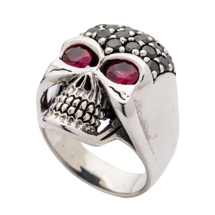 A femme fatale-style skull ring that embodies gothic glamour with its sparkling black crystals and piercing red eyes.