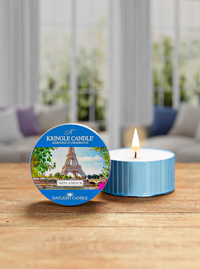 Kingle Candle daylight candle with packaging on a wooden surface