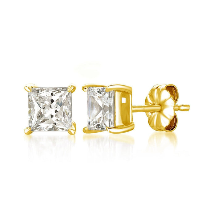Gold earrings with clear gemstones on a white background