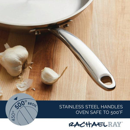 The 10-Inch Professional Stainless Steel Induction Frying Pan features a sturdy handle and is shown alongside garlic cloves on a wooden surface. This versatile skillet is oven safe up to 500°F, making it an ideal addition to any kitchen.