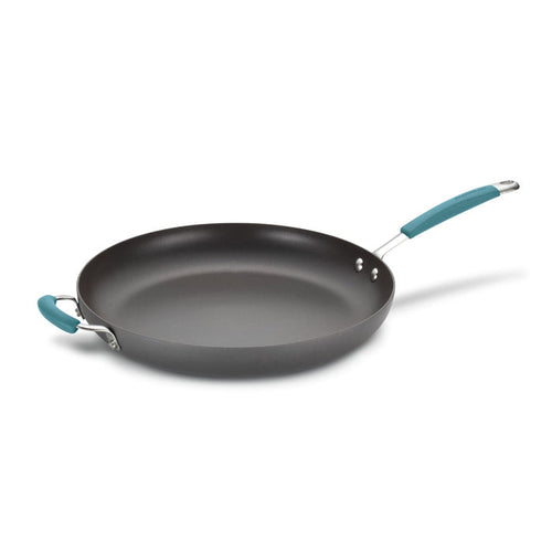 The 14-Inch Cucina Hard Anodized Nonstick Frying Pan with Helper Handle offers a nonstick surface, enhanced by a long handle and a comfortable blue grip, making it perfect for any culinary task.