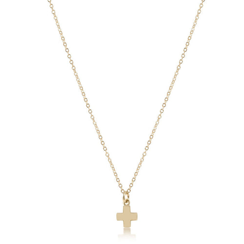 Gold necklace with a small cross pendant on a white background