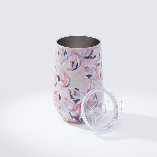 Tumbler with pink oyster pattern against white background