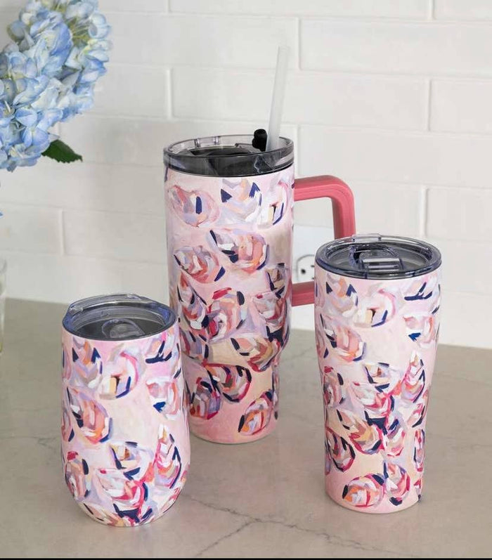 Tumblers with pink oyster pattern against white background