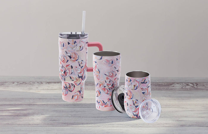 Tumblers with pink oyster pattern against gray background