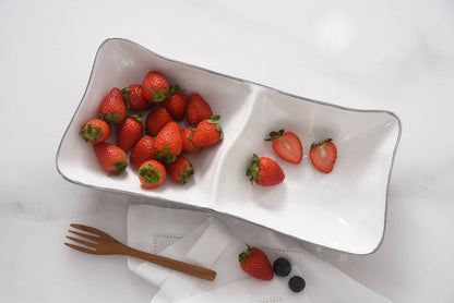 White ceramic dish with strawberries on a white background