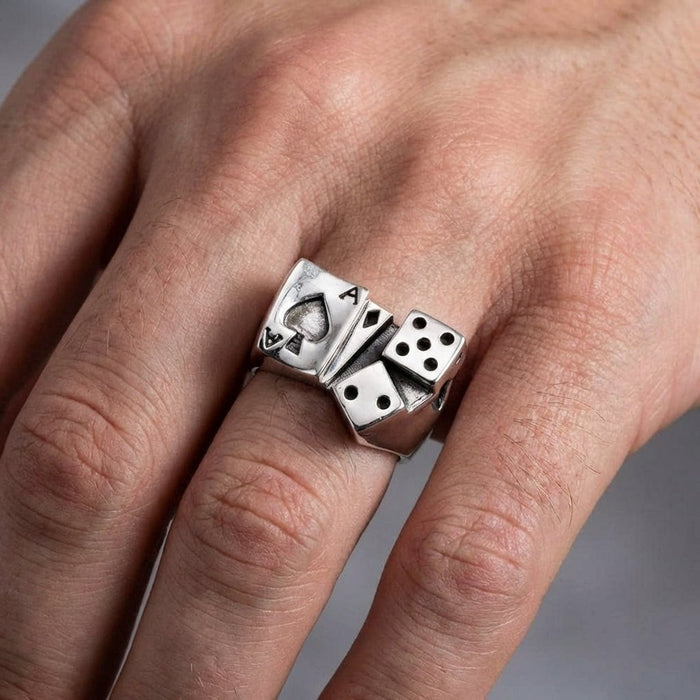 Man wearing sterling silver ace of spades and dice ring on finger demonstrating size and fit