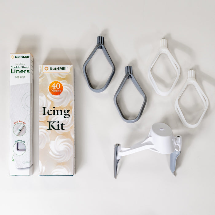 NutriMill bakers bundle including: cookie sheet liners, icing kit, pro line cookie paddles, cake paddles, and bowl scraper on grey background