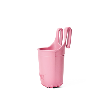 Pink plastic beverage holder on a white background