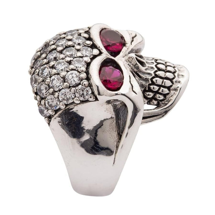 A gothic glamour skull ring with sparkling clear and deep red stones, a perfect statement of dangerous beauty.