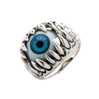 An angled view of the gothic blue eye ring, highlighting the 3D sculpt of the monster jaw.