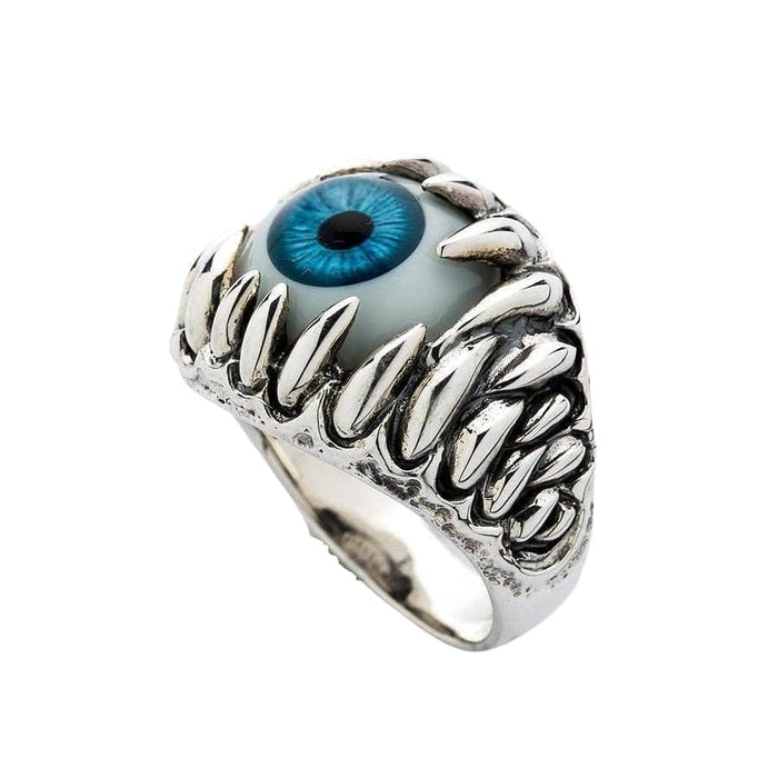 A side profile of the men's horror jewelry ring, showing how the teeth wrap around the blue eyeball.
