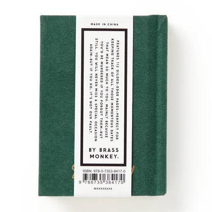 Green book with a label on a white background