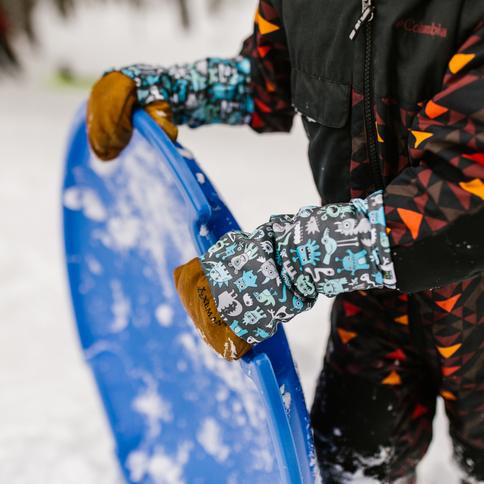 Snow Sleeves® Wrist Gaiters are a fun and functional wrist warmer that can be worn over or under jacket sleeves. These comfortable, unique wrist covers protect the gap between glove and jacket sleeves to keep the snow and cold out, so that you can focus on enjoying the outdoors. Snow Sleeves®  Wrist Gaiters and warmers invented and made in the USA by AdventureUs in Washburn Wisconsin.