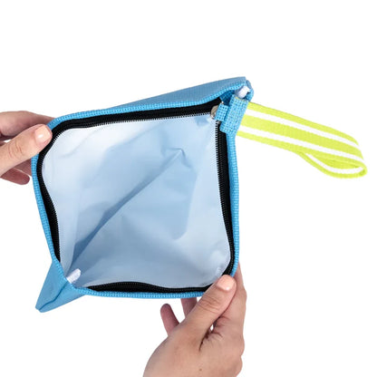Blue pouch with a yellow strap held by a hand on a white background