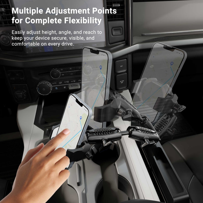 A hand adjusts the Car Seat Wedge RoadVise® Ultra Phone Holder with Dual Shaft Arms, securely mounted near the gearshift and displaying a navigation map on the phone screen. Text above highlights the flexible dual shaft arms for customized comfort and optimal visibility while driving—making this an ideal phone mount for trucks needing secure and convenient access to navigation on the road.