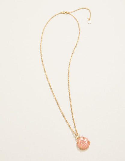 Gold necklace with a pink shell pendant on a white background