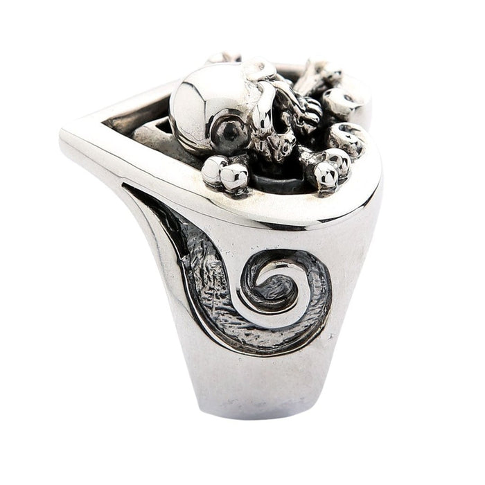 Side profile of the ring showing the thick band and tribal carving texture