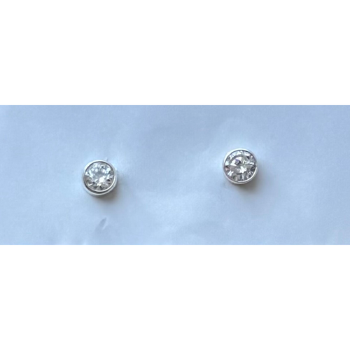925 Sterling silver post earrings with a crystal in bezeled setting. 5 mm diameter