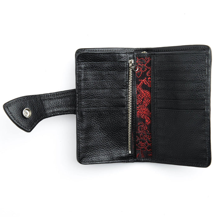 The spacious interior of a black leather custom biker wallet, with 12 card slots and multiple large compartments.