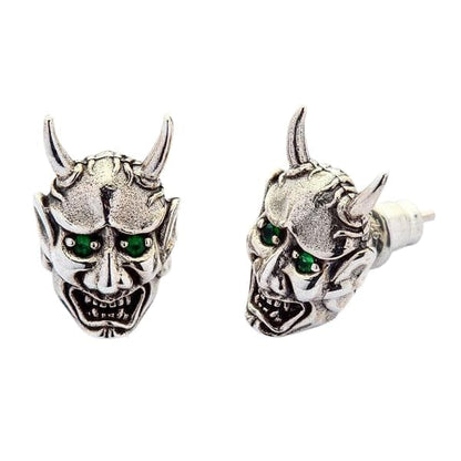 A front and side view of the Hannya mask style earrings with green eyes, isolated on a white background.