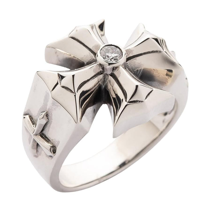 Close up of diamond-white crystal set in silver cross ring