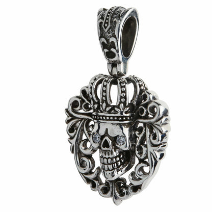 Three-quarter angle showing the pendant's 4mm depth and the hollow interior of the engraved fleur-de-lis bail