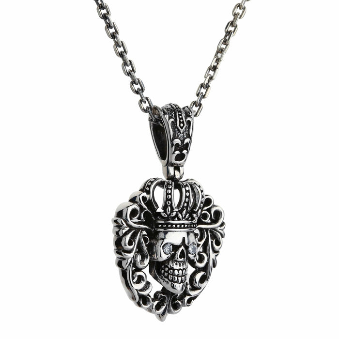 Angled shot on a chain shows the 22-gram pendant hanging straight, its scroll frame catching studio light
