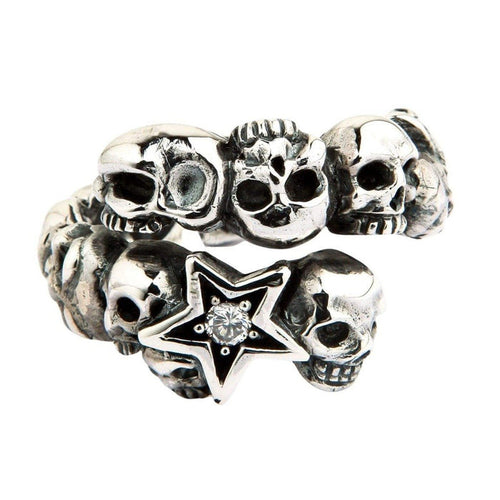 Frontal studio shot of the .925 silver wrap band displaying the tiered skull design and faceted stone star centerpiece.