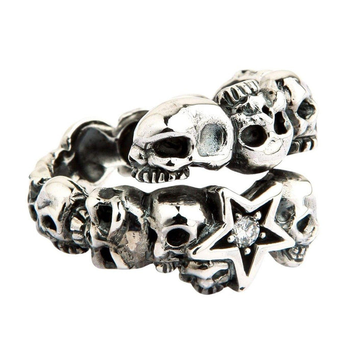 Coiled .925 silver wrap ring on a white background, emphasizing the gap between the top skull and the jeweled star end.