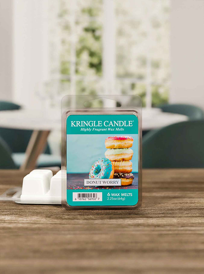 Kringle Candle wax melts packaging on a table with a blurred background