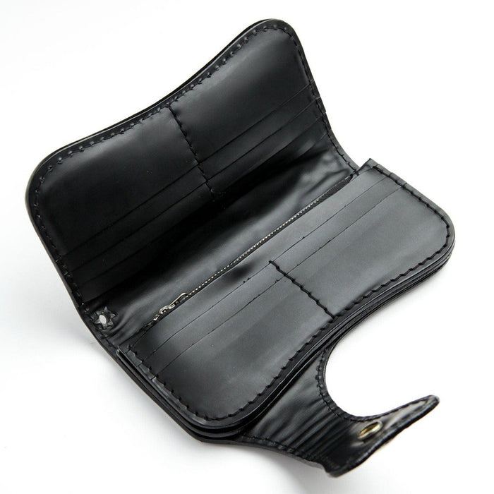 Open interior layout of the black leather wallet featuring multiple stitched card slots and a central zippered coin pouch.