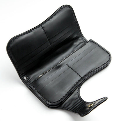 Open interior layout of the black leather wallet featuring multiple stitched card slots and a central zippered coin pouch.