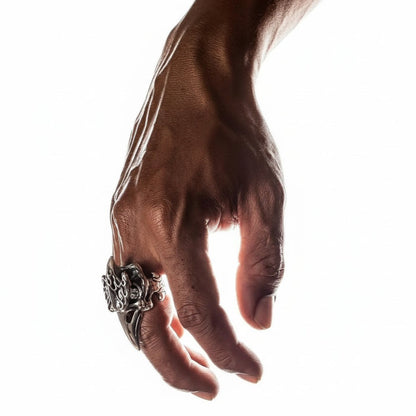 An alternative view on hand of the heavy 30-gram silver biker ring with a fire raven skull design.
