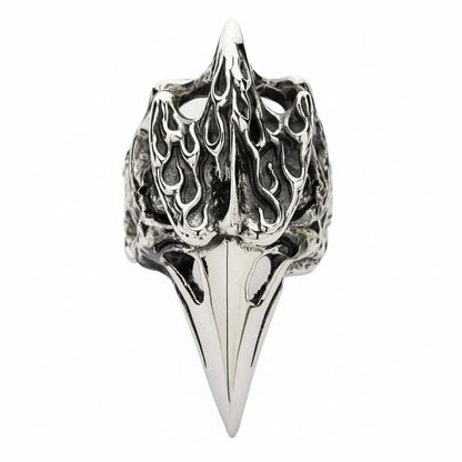 A front view of the heavy sterling silver fire raven skull ring with a long polished beak.