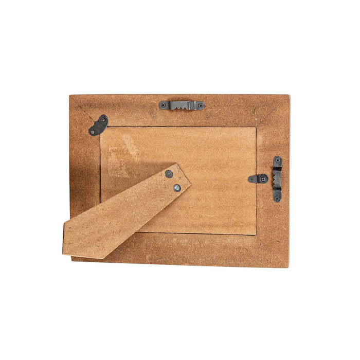 back side of wooden frame against a white background
