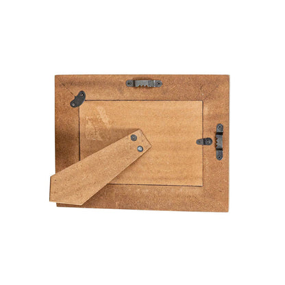 back side of wooden frame against a white background