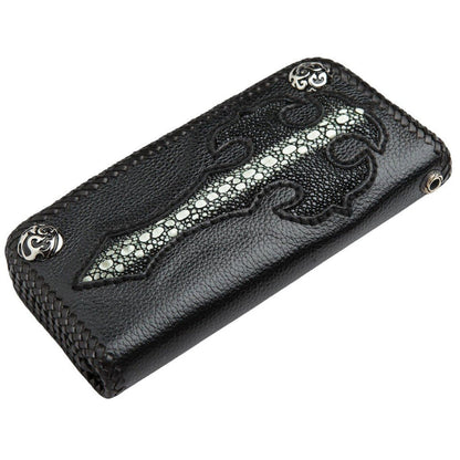 Black leather wallet with a flush-inlaid stingray skin cross, braided edges, and silver corner accents.