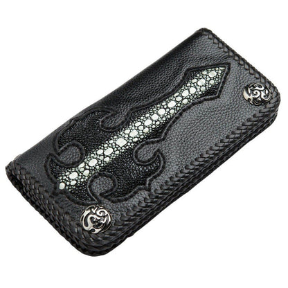 Top-down look at the wallet's front cover, showcasing the textured stingray cross inlay and decorative silver conchos.