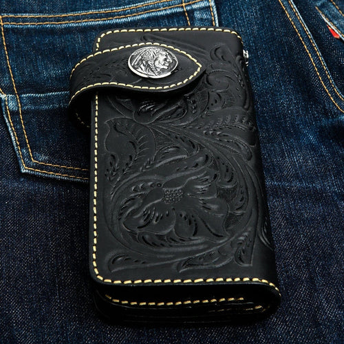 A men's hand-tooled black leather biker wallet with a detailed floral pattern and an Indian Head concho.