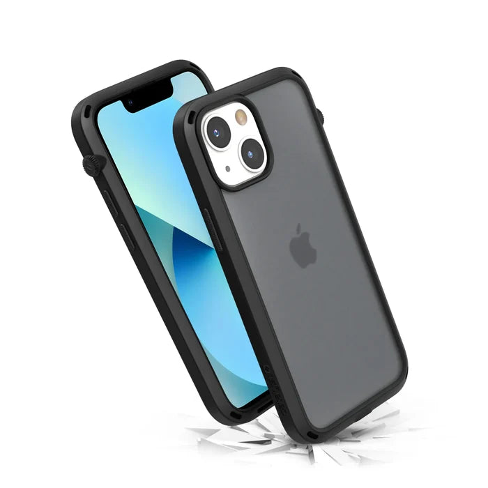 Two iPhone 13 mini devices in Stealth Black Catalyst Influence CasesÃƒÂ¢Ã¢â€šÂ¬Ã¢â‚¬Âone upright with a blue screen, one leaning to show the Apple logo and dual cameraÃƒÂ¢Ã¢â€šÂ¬Ã¢â‚¬Ârest on shattered glass, showcasing MIL-STD 810G drop proof shock protection.