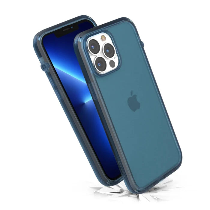 Two Pacific Blue iPhone 13 Pro Max devices in Catalyst Case US Influence Cases are shownÃƒÂ¢Ã¢â€šÂ¬Ã¢â‚¬Âone upright with a blue gradient screen, the other bouncing off debris, highlighting Drop Proof MIL-STD 810G protection and wireless charging compatibility.