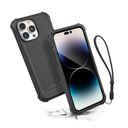 Two iPhone 14 Pro Max smartphones in Catalyst Case US Crux Cases (Stealth Black, Magsafe Compatible) are shownÃƒÂ¢Ã¢â€šÂ¬Ã¢â‚¬Âone displays three rear cameras; the other with a black wrist strap bounces on a cracked surface, proving its drop-proof protection.
