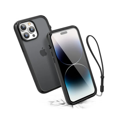 The Catalyst Case US Influence Case for iPhone 14 Pro Max in Stealth Black, shown with a wrist strap, is MIL-STD 810G drop proof and supports wireless charging. Both iPhones above cracked surfaces highlight its rugged durability.