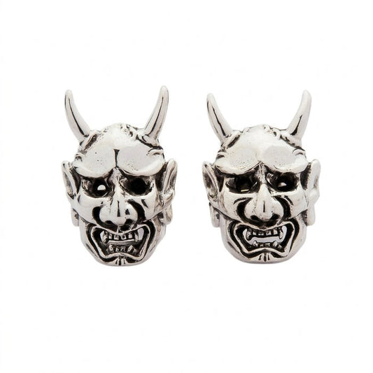 Pair of .925 sterling silver stud earrings shaped like Japanese Oni demon masks featuring curled horns and snarling mouths.