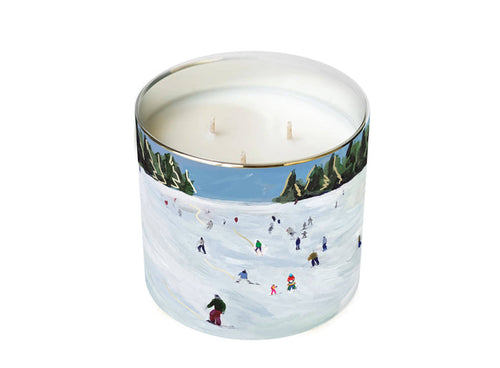 candle with ski slope design against a white background