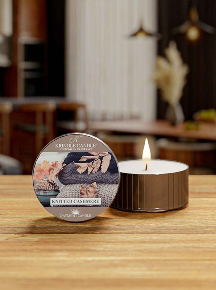 Keenlite candle with packaging on a wooden surface