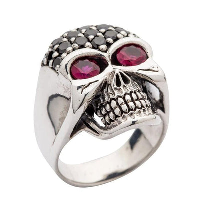 A unique women's gothic skull ring in solid 925 sterling silver, adorned with brilliant red and black stones.