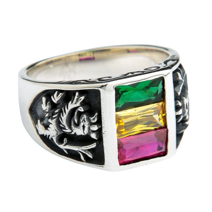A side view of the ring, highlighting the vibrant green, yellow, and red gemstones that represent the Ethiopian flag.
