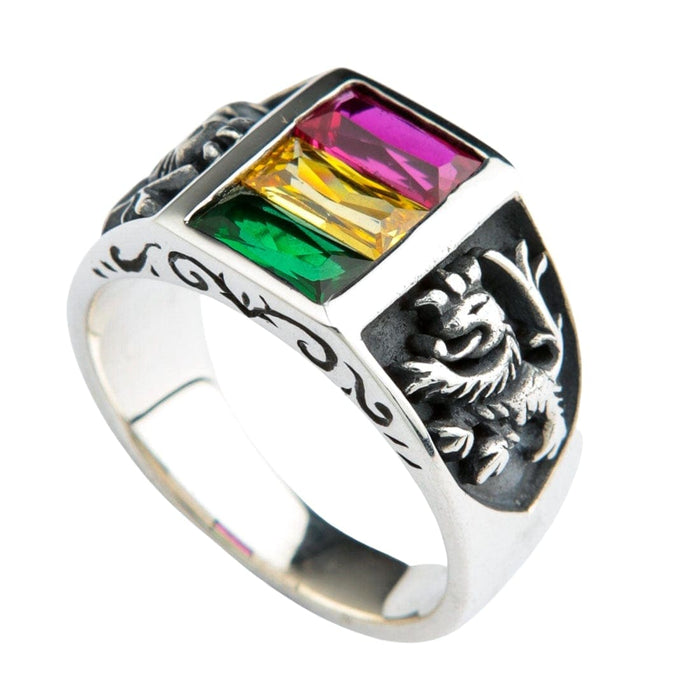 A side view of the silver Rasta ring, highlighting its classic signet shape and the three vibrant gemstones.